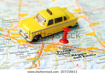Close up of  Parma , Italy map with red pin and a taxi   - Travel concept