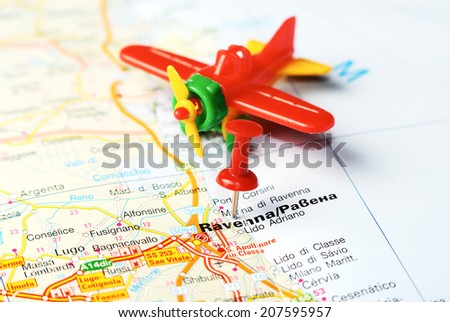 Close up of  Ravenna   , Italy map with red pin and airplane    - Travel concept