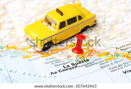 Close up of La Spezia  , Italy map with red pin and a taxi   - Travel concept