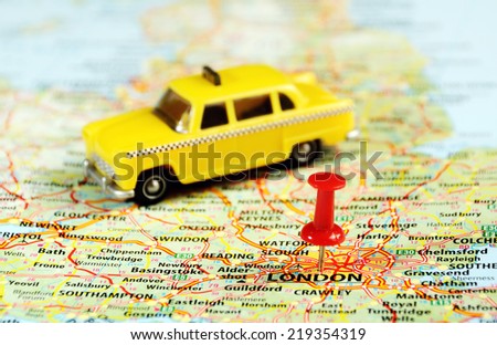 Close up of  London ,United Kingdom  map ,taxi  car and  pin - Travel concept