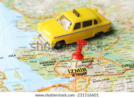 Close up of  Izmir ,Turkey  map with red pin and a taxi   - Travel concept
