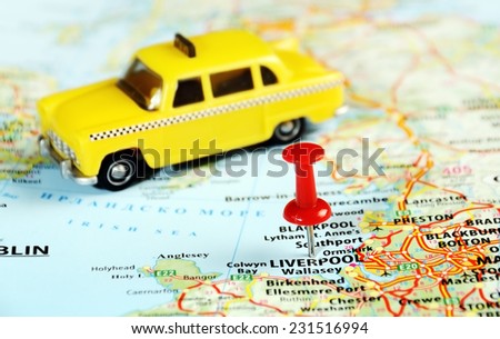Liverpool  ,United Kingdom map with red pin and taxi car  - Travel concept