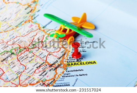 Airplane toy on  Barcelona ,Spain  map and red pin - Travel concept
