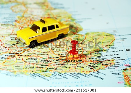 Close up of  London ,United Kingdom  map ,taxi  car and  pin - Travel concept