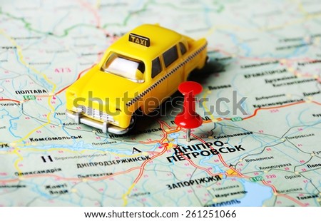 Close up of  Dnepropetrovsk  ,Ukraine , map with red pin and a taxi toy