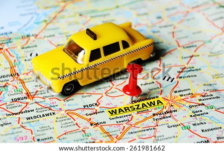Close up of   Warsaw  , Poland  map  pin and taxi toy