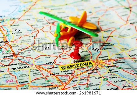 Close up of   Warsaw  , Poland  map with red pin airplane toy