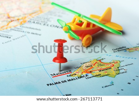 Close up of  Majorca  island , Spain  map  pin and airplane toy