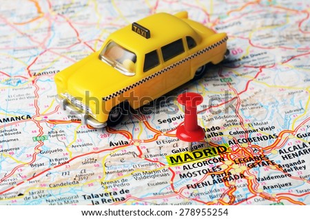 Close up of Madrid  ,Spain map  red pin and a taxi toy - Travel concept