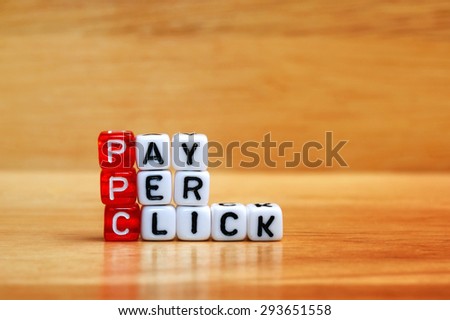 PPC Pay Per Click text on  dices on wooden background