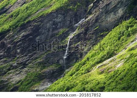 waterfalls northern Norwegian fjords.