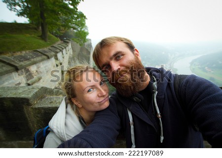 In love couple in Koenigstein . A man and a woman in a wedding trip to Europe in the fall.