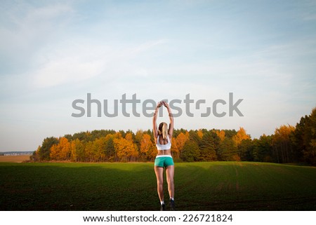 woman goes in for sports. Walks through Europe. autumn in the park. gold-covered trees