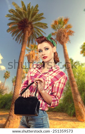 pin-up girl with a suitcase goes on vacation. Pin up vintage retro lifestyle