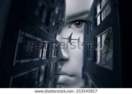view from above. Custom angle view of a woman staring down at the city. double exposure.