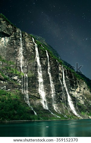At night, under the light of stars. Geiranger fjord, Norway - waterfalls Seven Sisters.