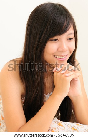 stock photo Young chinese girl squatting