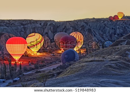 Colorful hot air balloons before launch   at Cappadocia, Turkey. Volcanic mountains in Goreme national park.