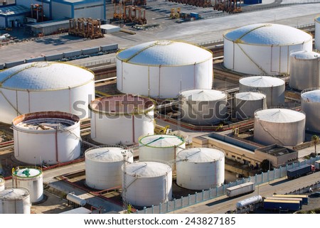Big gas storage tanks seen in a harbour