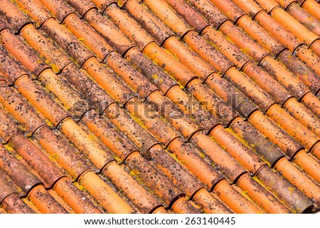 Old and dirty red roof tiles
