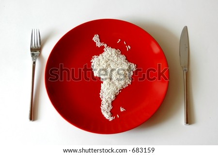 shape of Southern America made of rise on a red plate