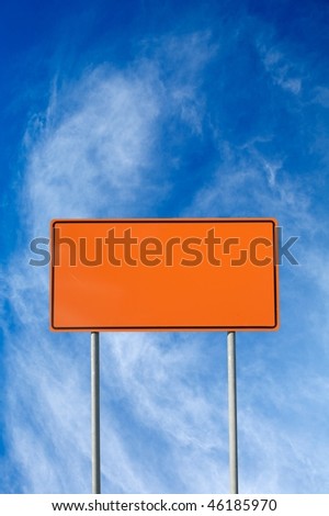 Blank construction sign against cloudy sky