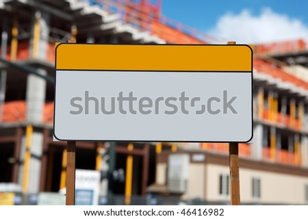 Blank construction sign against construction site