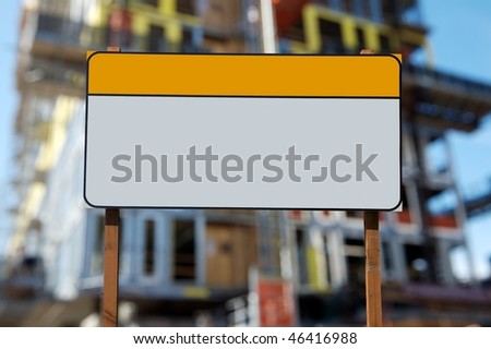 Blank construction sign against construction site