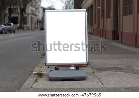 Blank sidewalk sign on city sidewalk