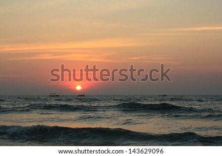 Bright and beautiful sunset on Goa beach.