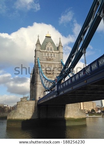 Tower Bridge over the Thames River is one of the most well-known symbols of  London.