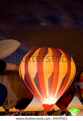 A hot air balloon at a night glow.