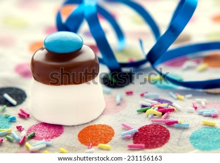 Marshmallow Top Hats with Chocolate Smarties Party Treats single with blue streamer and spotty background