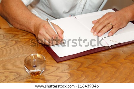 witness signing marriage license or wedding contract in wedding book
