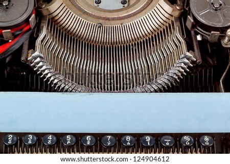 retro typewriter close up with number keys and letters mechanism