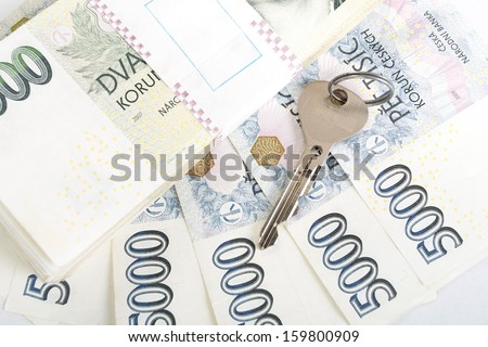 czech banknotes nominal value one and two thousand crowns and key as money concept key to Success