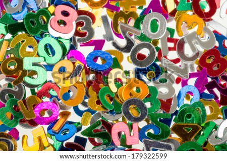 close up of small color numbers confetti background or backdrop