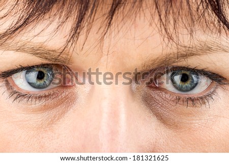 shoot of beautiful middle age woman opened eye macro