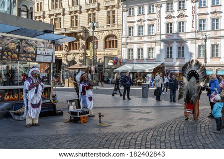 PRAGUE, CZECH REPUBLIC - MARCH 13th, 2014 - American indians play music for tourists. Wenceslas square is centre of the business and cultural communities in the New Town of Prague.