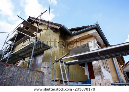 Construction or repair of the rural house, fixing facade, insulation and using color