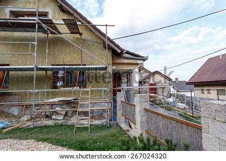 Construction or repair of the rural house, fixing facade, insulation and using color for new look