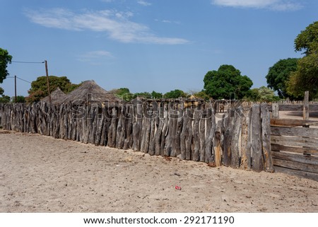 Traditional african village with housed and wooden fence in Namibia, near town Kavango in region with the highest poverty level in Namibia