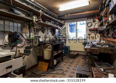 real dirty domestic DIY home workshop full of tools, untidy, ready for work