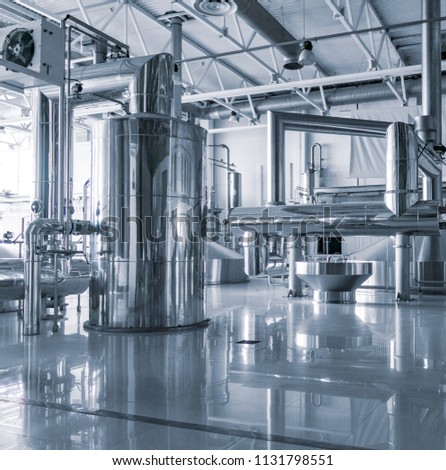 Modern interior of a brewery mash vats metal containers