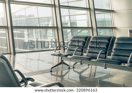 airport waiting area, seats and outside the window scene