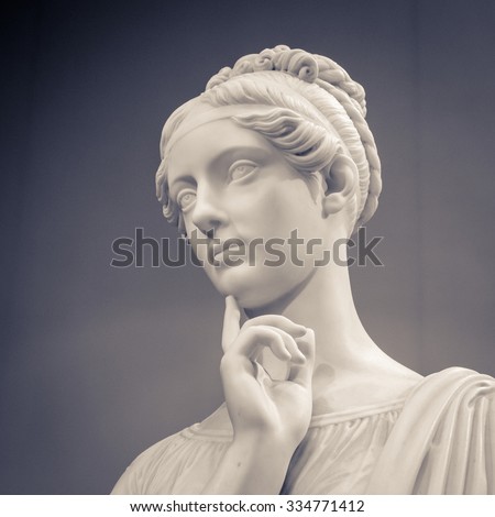 White marble head of young woman.
