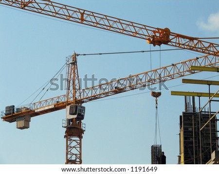 Lifting cranes over frame-house