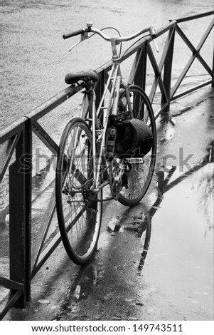 Bicycle on the street in the pouring rain (Paris, France)