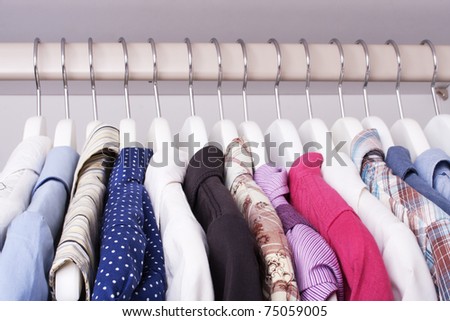 beautiful clothes in the closet on a hanger (selective focus)
