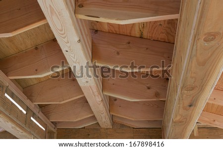 Wood frame of a house roof under construction